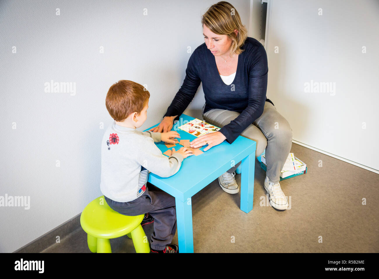 Child in a session with a speech therapist. Stock Photo