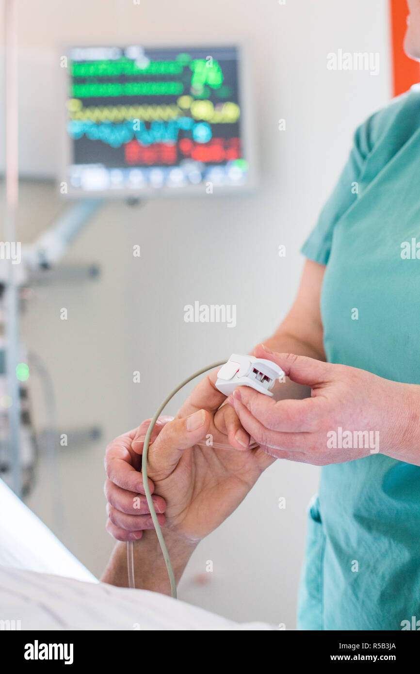 Determination of oxygenhemoglobin saturation of blood with a pulse oximeter Stock Photo Alamy