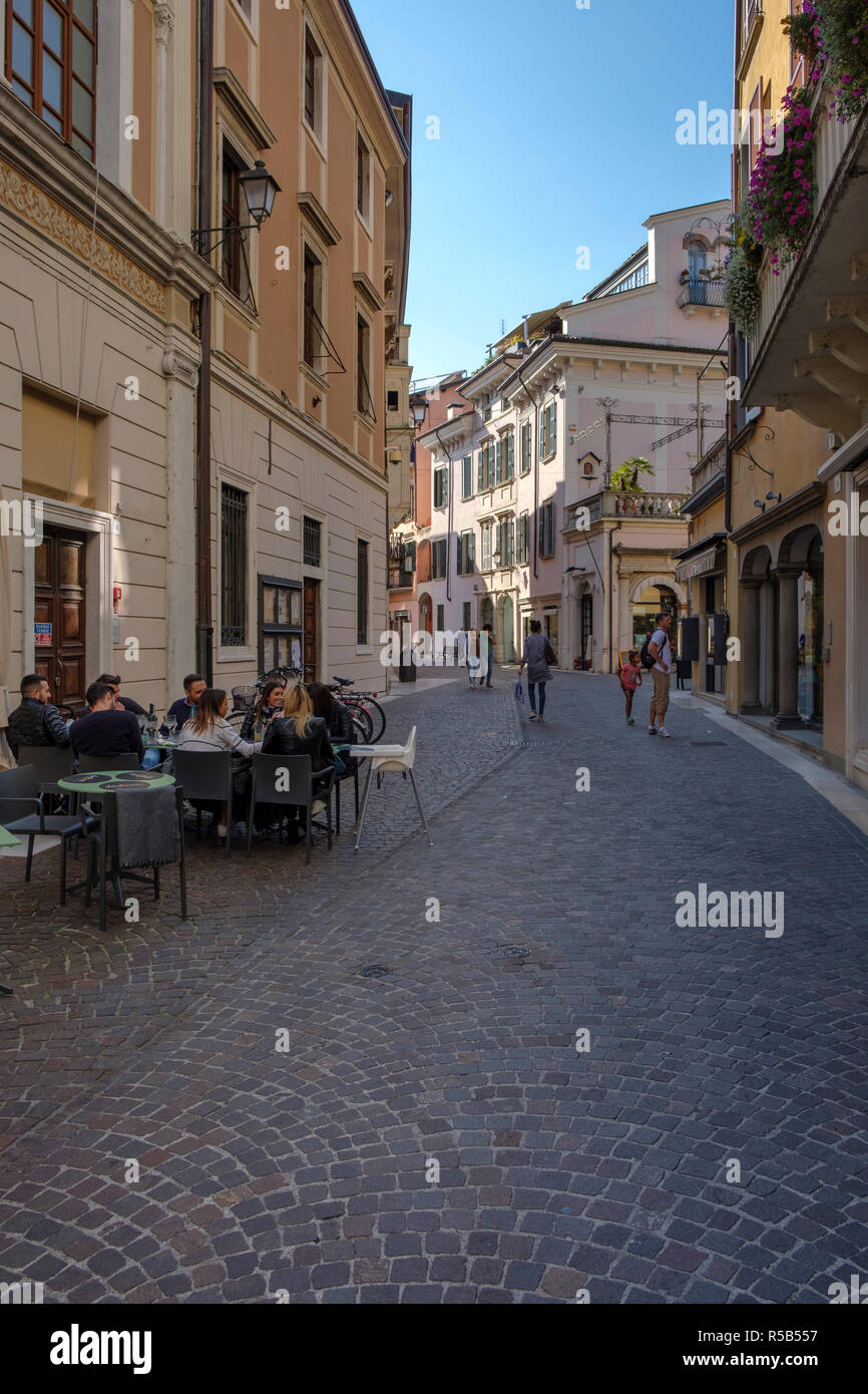 Narrow alley in Salo, shopping street, Lake Garda, Brescia, Lombardy, Italy Stock Photo