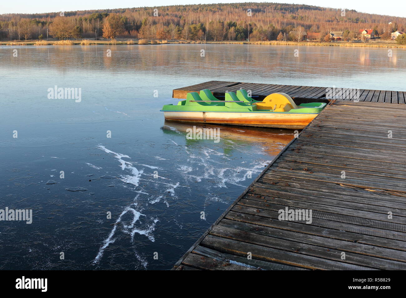 Pedalo boat trapped in ice Stock Photo