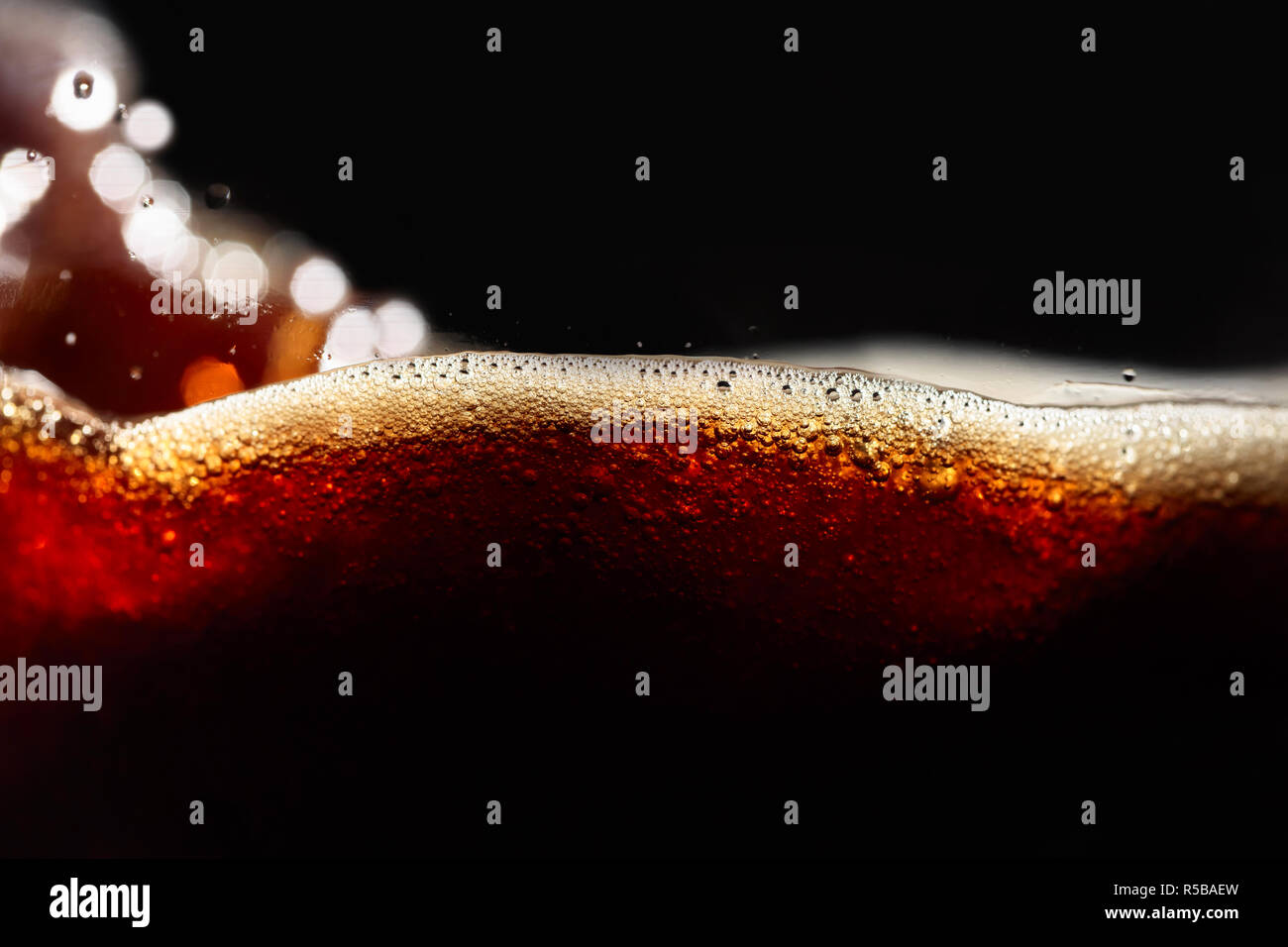 Close up of coffee splashes on a black background Stock Photo - Alamy