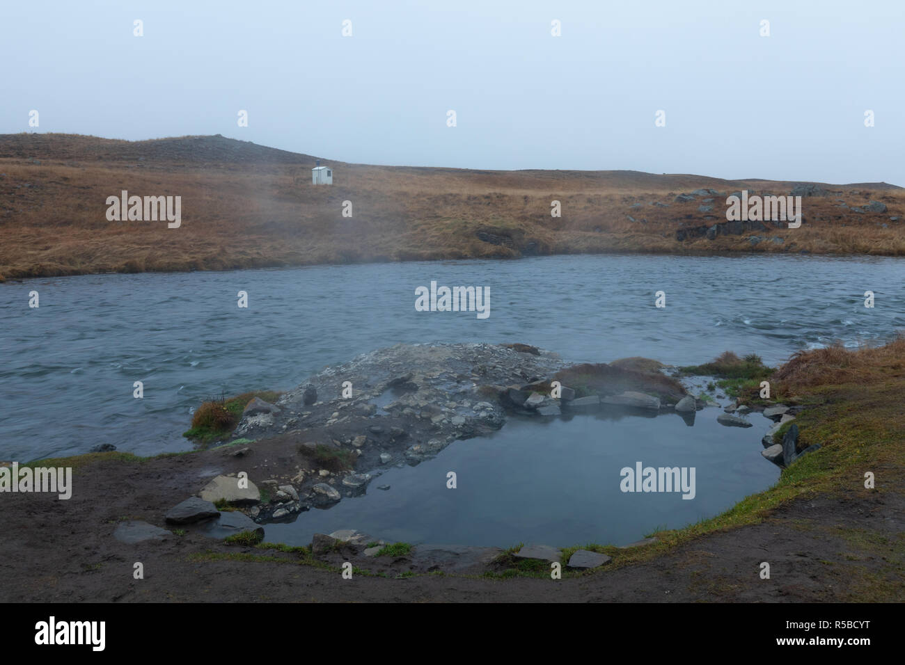 Natural geothermal pool next to Reykjafoss waterfall in iceland Stock Photo