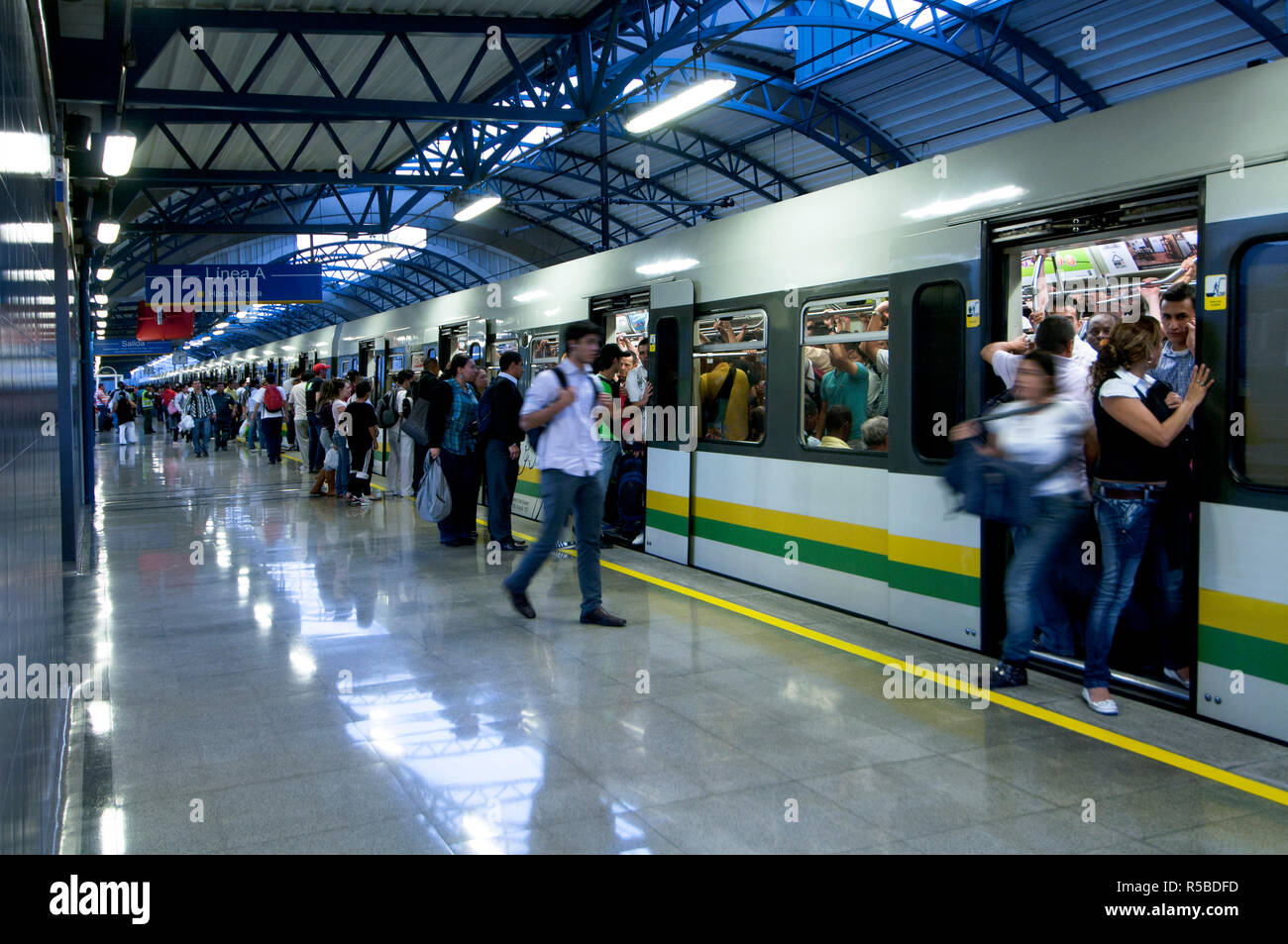 Medellin, Colombia, Elevated Metro Stop, Passengers Load And Unload, Urban Train Stock Photo