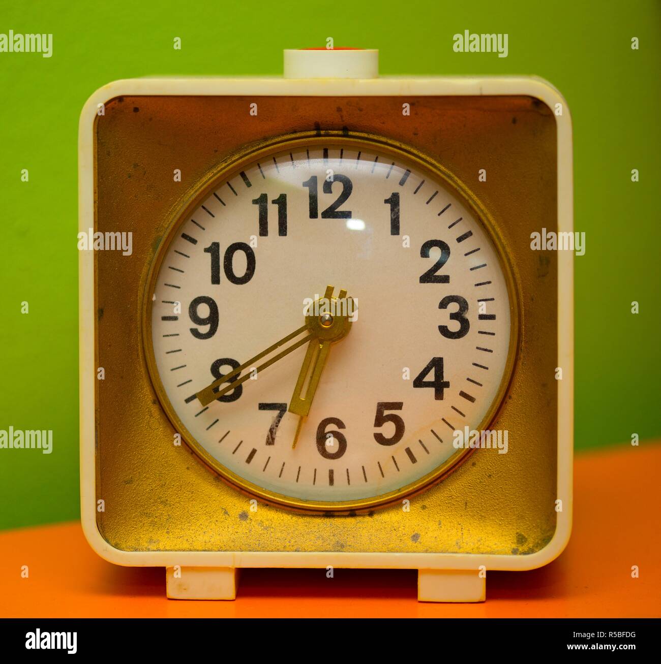 old retro alarm clock at the red and green tones Stock Photo - Alamy