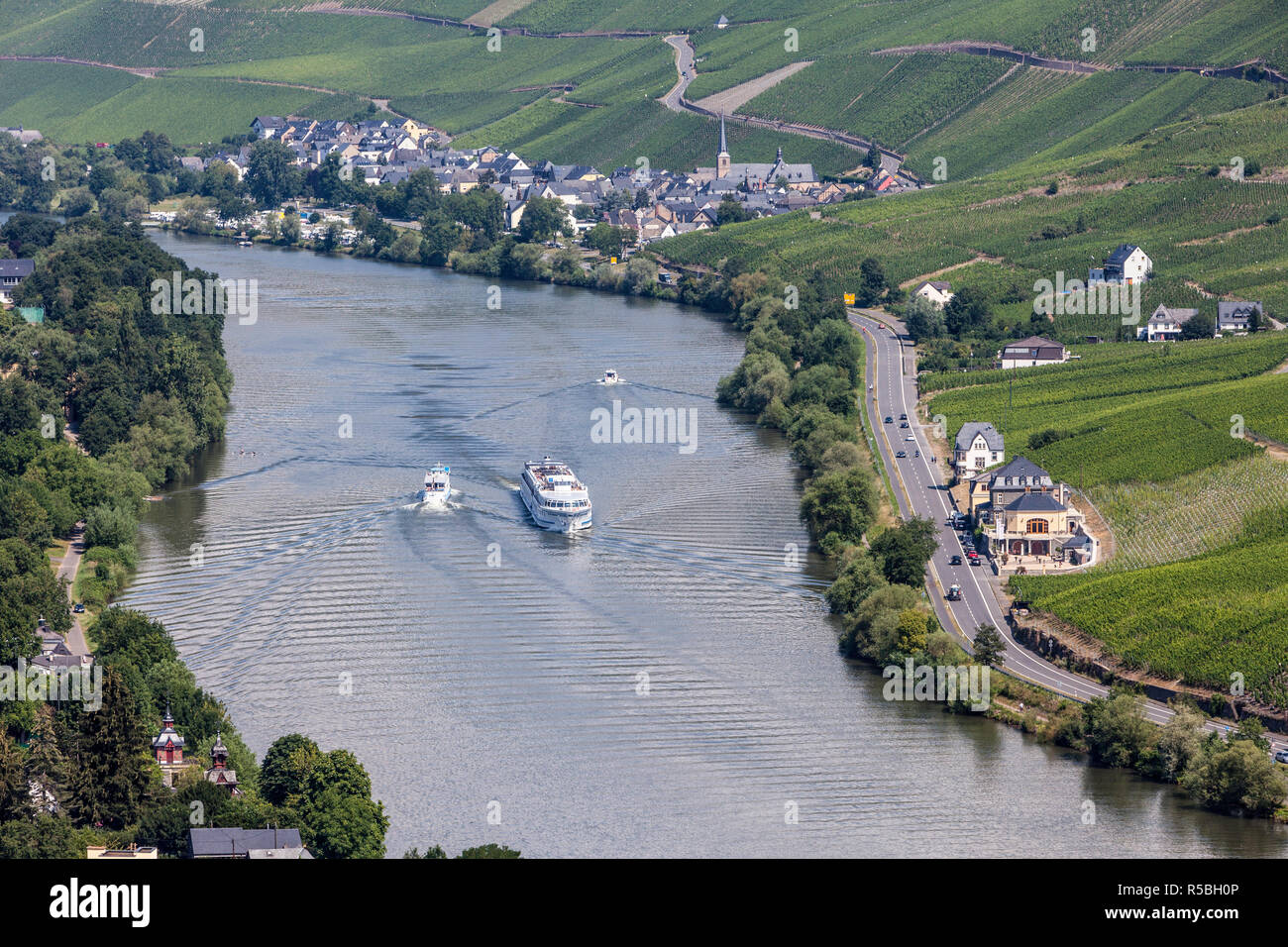Bernkastel, Germany.  Tourist Boat and Two Small Pleasure Boats on the Moselle River. Stock Photo
