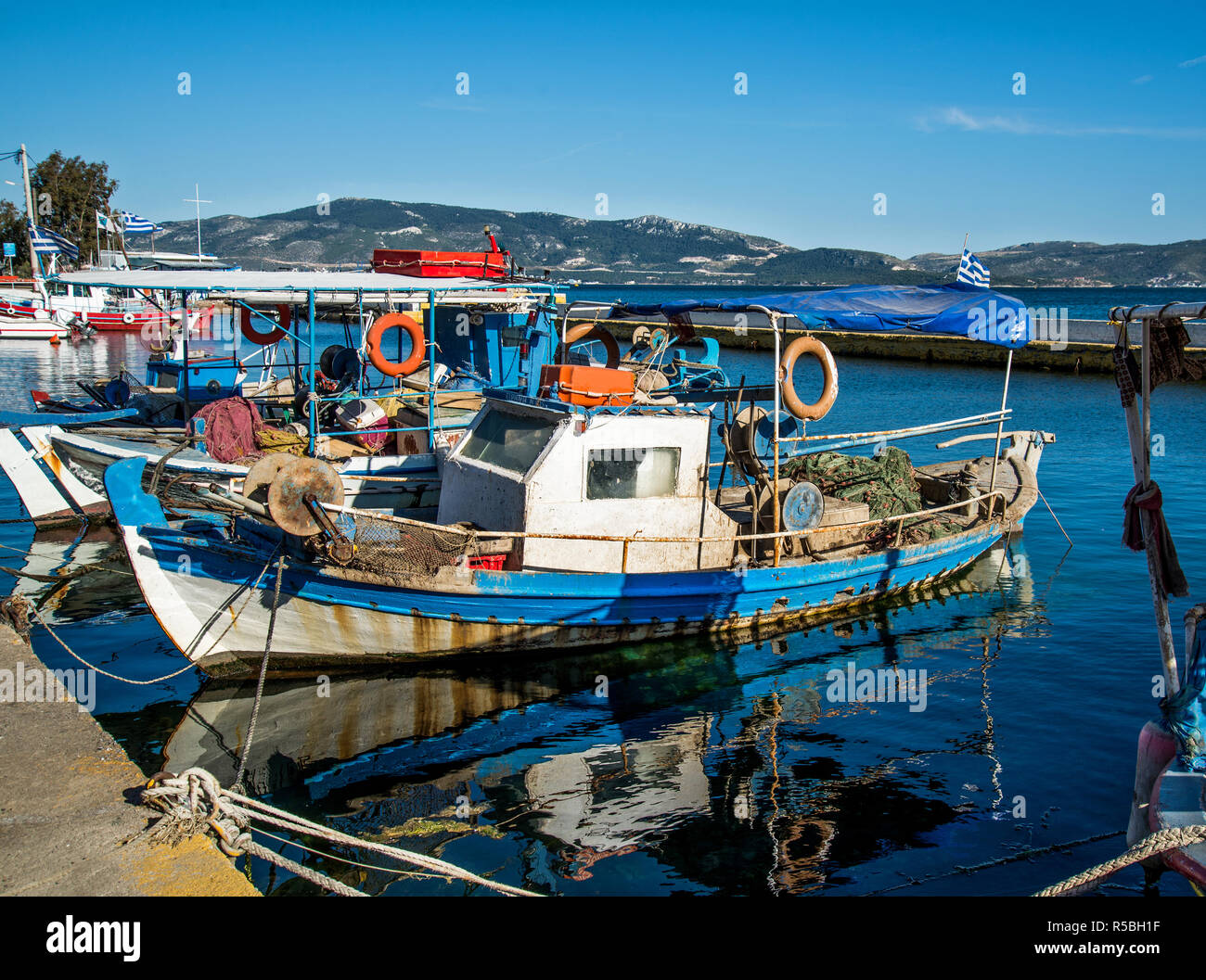 Traditional wooden fishing boat in the port of Elefsina, Greece Stock Photo  - Alamy