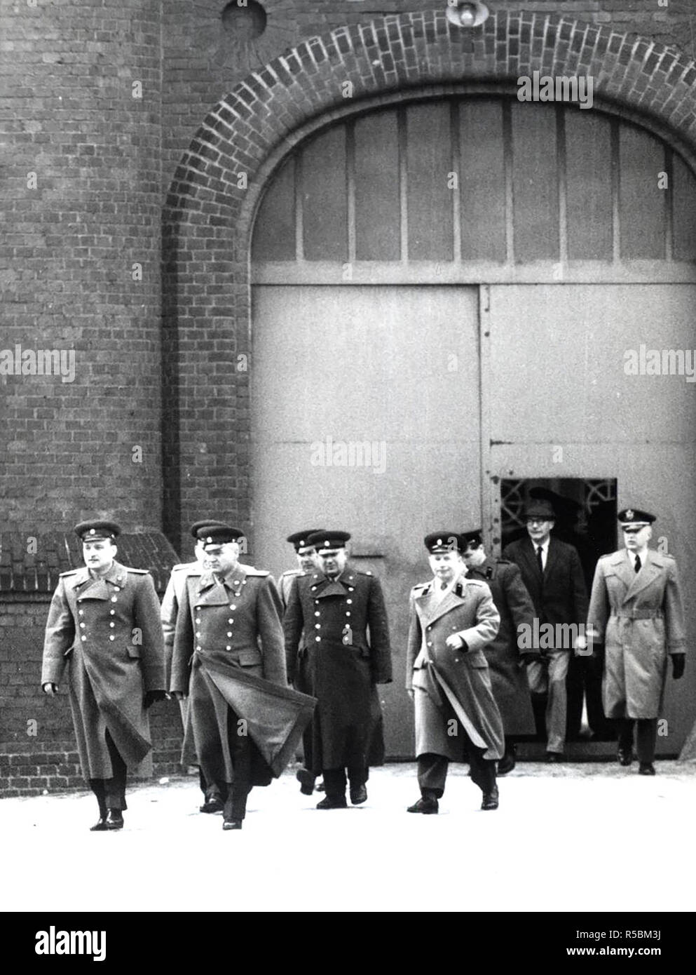4/1/1962 -  The Senior Soviet Commander Lt. Col. Solowjew (Second From Left) Arrived at The Spandauer War Criminal Prison On April 1, 1962. On This Day Americans Are Relieving Soviet Guards of Their Duty at The Prison. Lt. Col Solojew Entered The Prison Over The British Sector Since He Was Denied Access By Americans to West Berlin On Their Border. Stock Photo