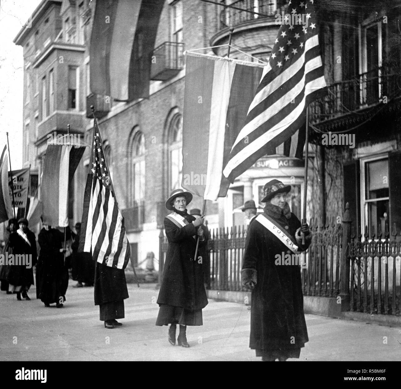 Suffragette Picketers carrying flags ca. 1910-1920 Stock Photo