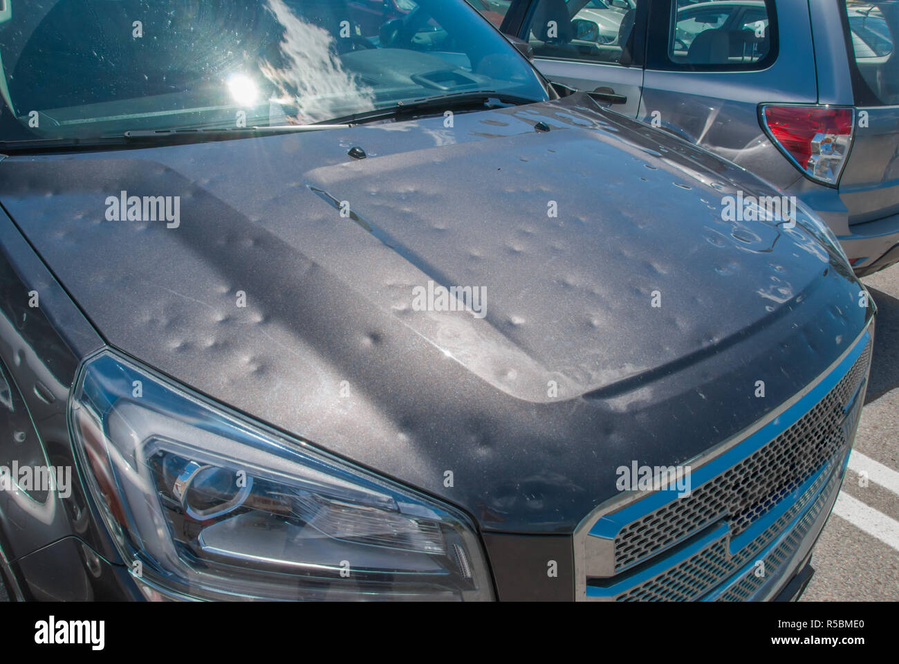 Hail damage to a car Stock Photo