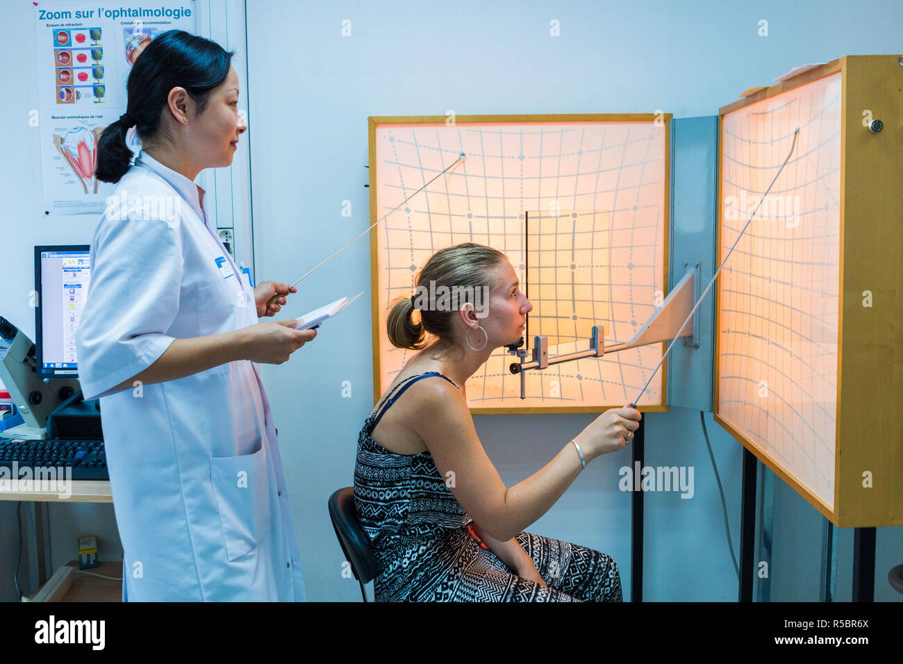 Woman undergoing orthoptic check-up with an orthoptist, France. Stock Photo