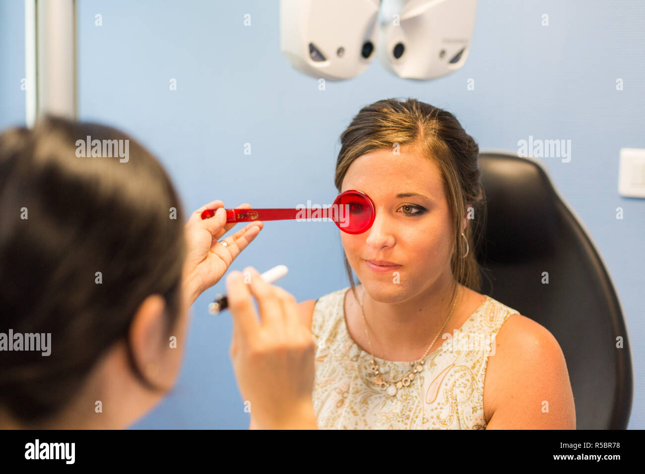 Woman undergoing orthoptic check-up with an orthoptist, France. Stock Photo