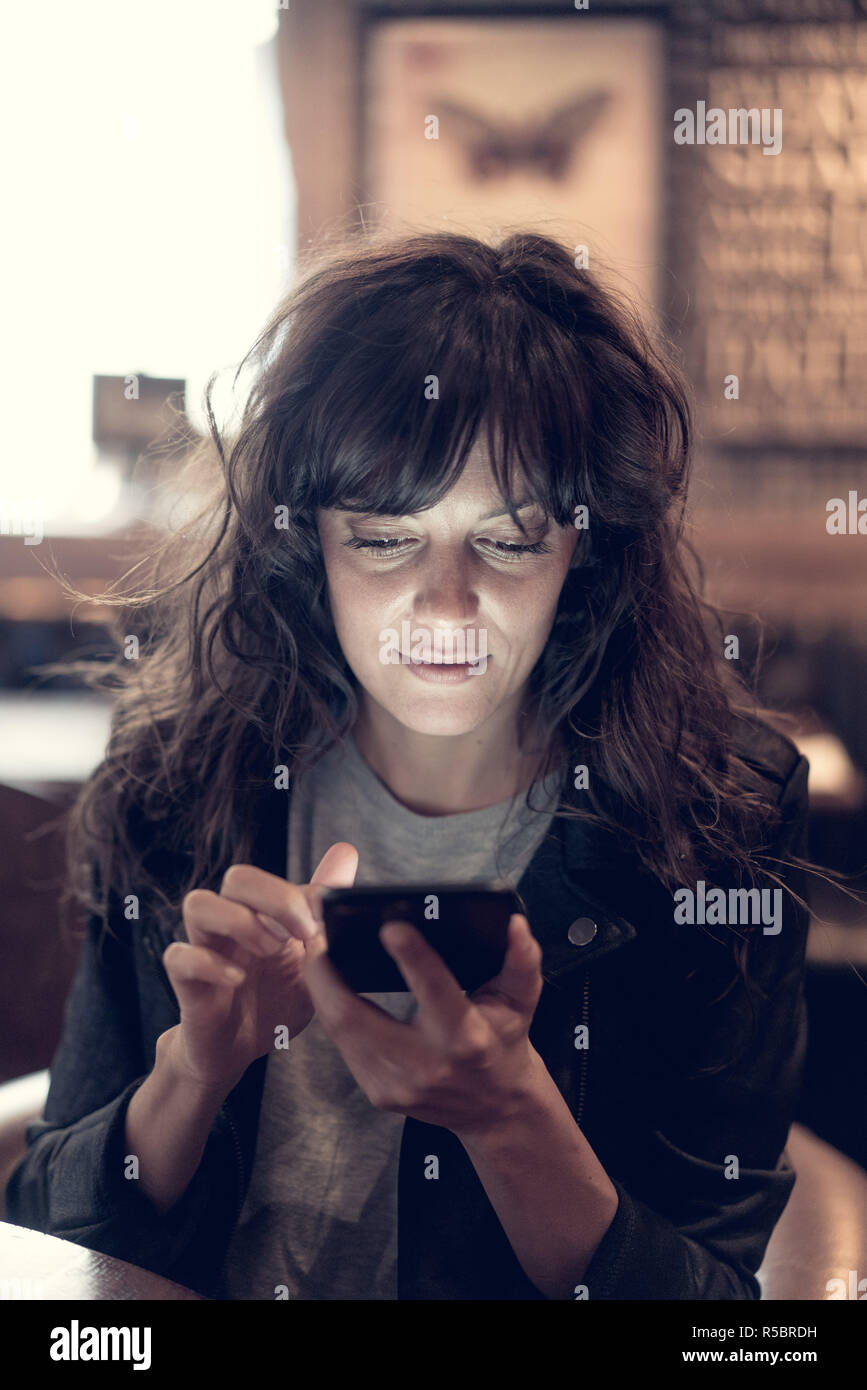 Woman using smartphone. Stock Photo