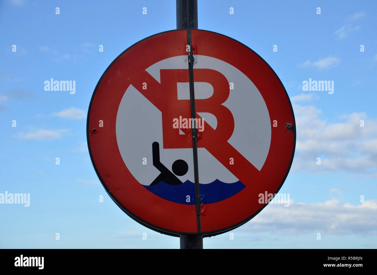 A no swimming sign on the beach at Ostend in Belgium Stock Photo