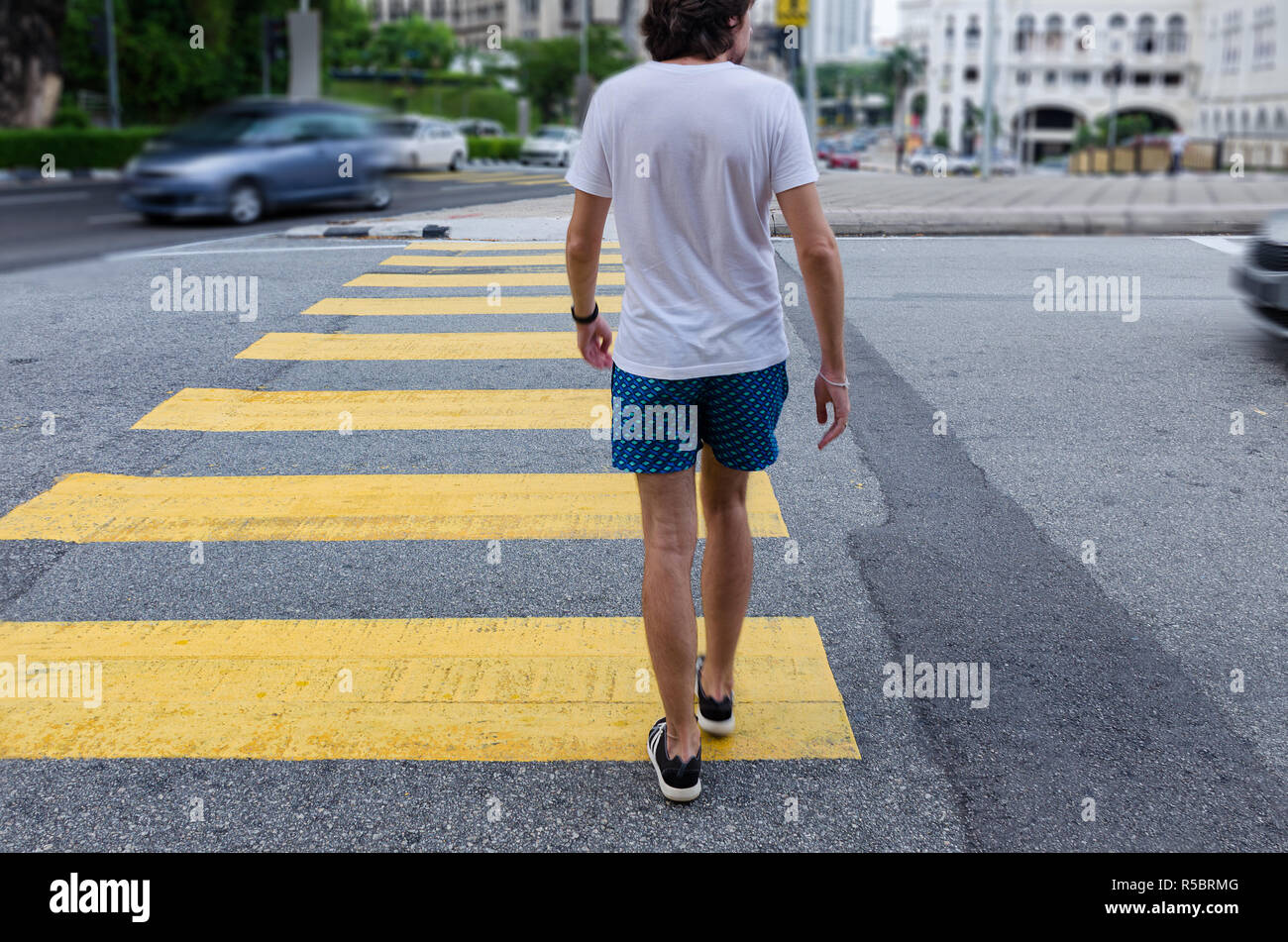 Man In Jeans Walking Across A Zebra Crossing Stock Photo - Download Image  Now - Crosswalk, Zebra Crossing, Crossing - iStock