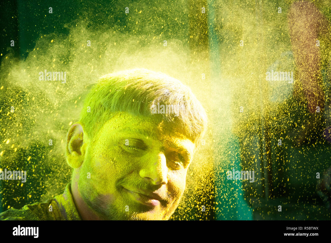 Young man play Indian festival Holi Stock Photo