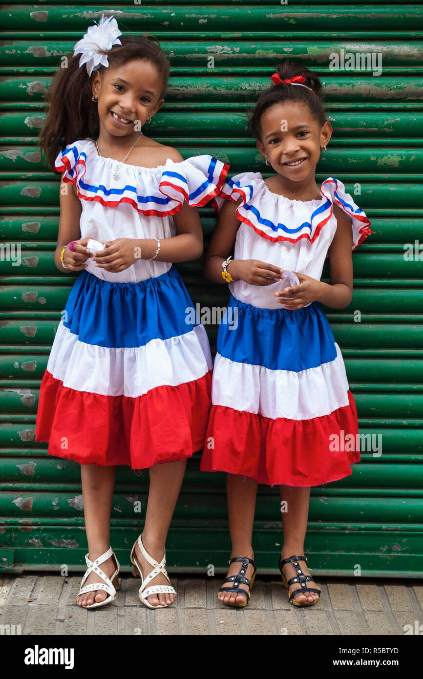 Dominican Republic, Santa Domingo, Colonial zone, Two girls dressed in Dominican flag colours on Independence day Stock Photo