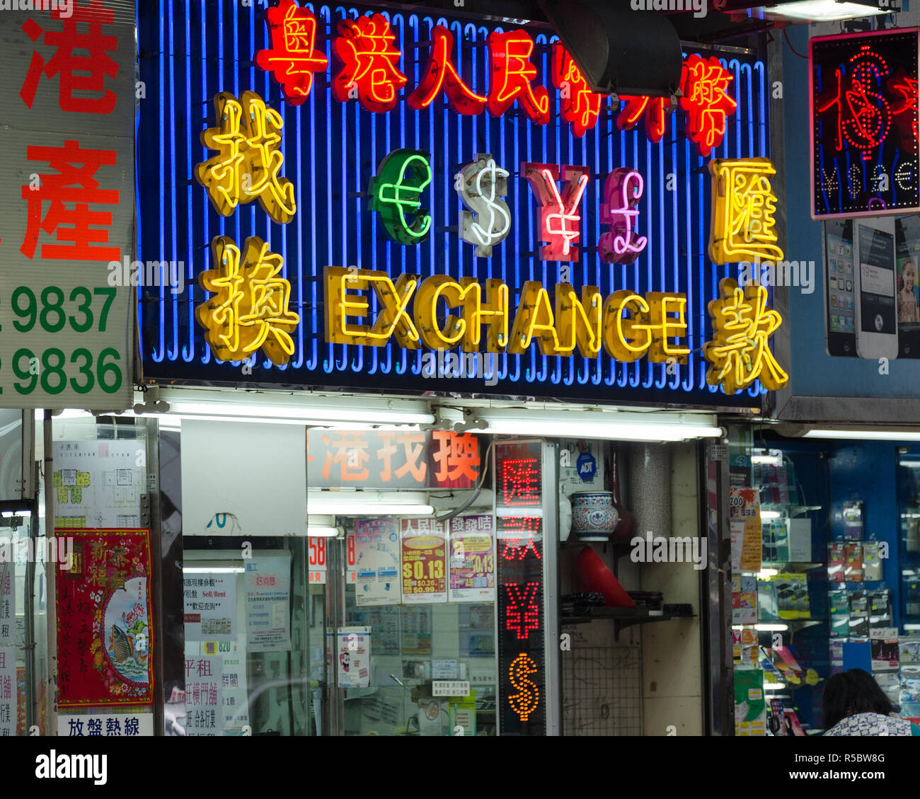 Hong Kong, 2018-03-06: Sign exchange, inscription in Chinese, neon lighting at night. Stock Photo