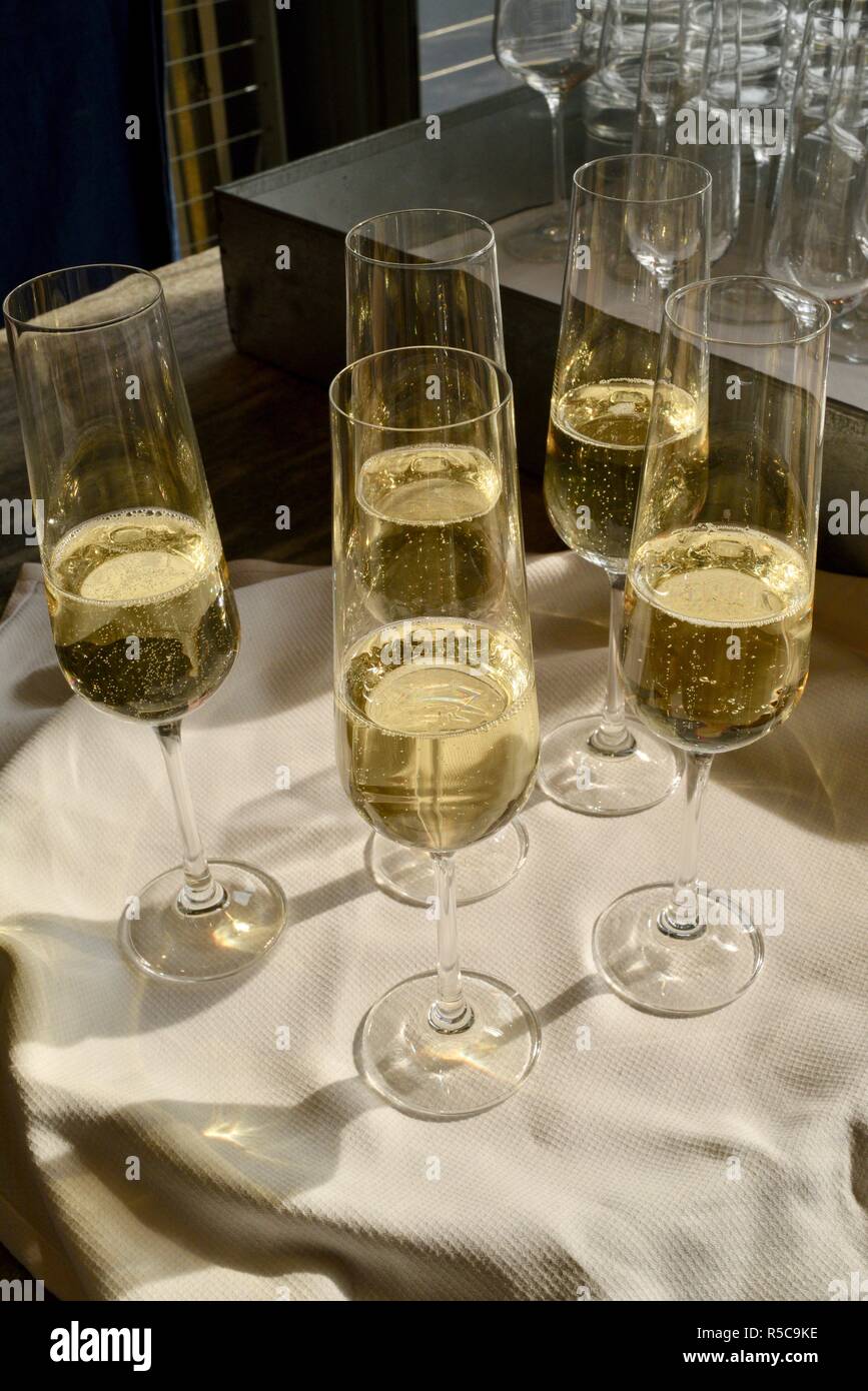 Champagne sparkling wine from a bottle poured in glasses and served at
