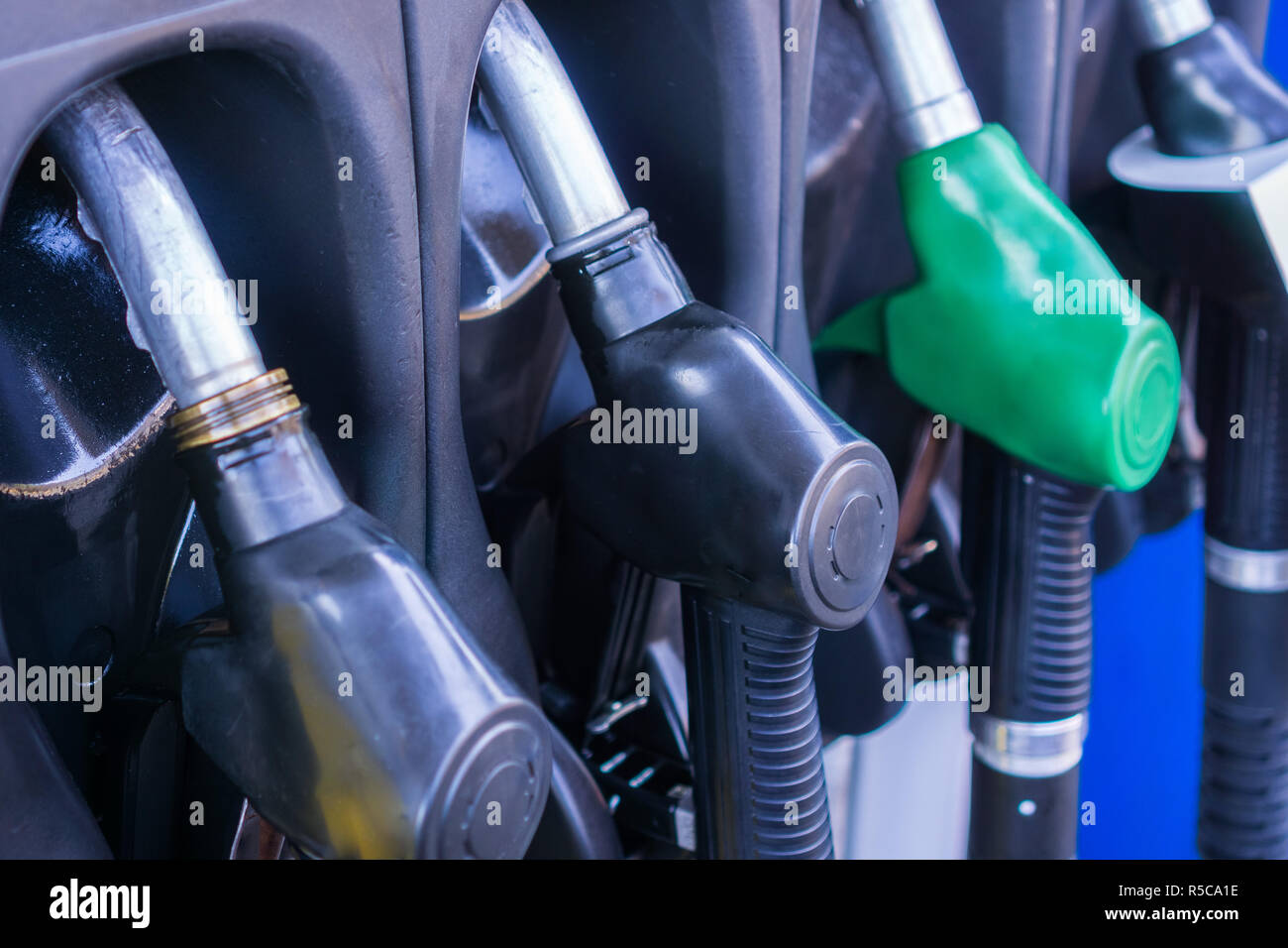 Close up of gas pump nozzles in a service station Stock Photo
