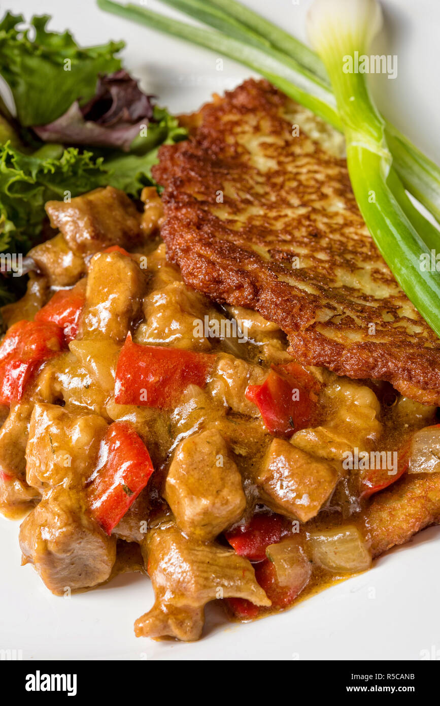 hungarian goulash with potato pancakes Stock Photo Alamy