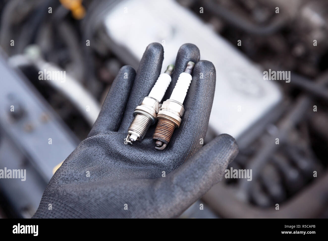 Spark plug, old and new Stock Photo Alamy