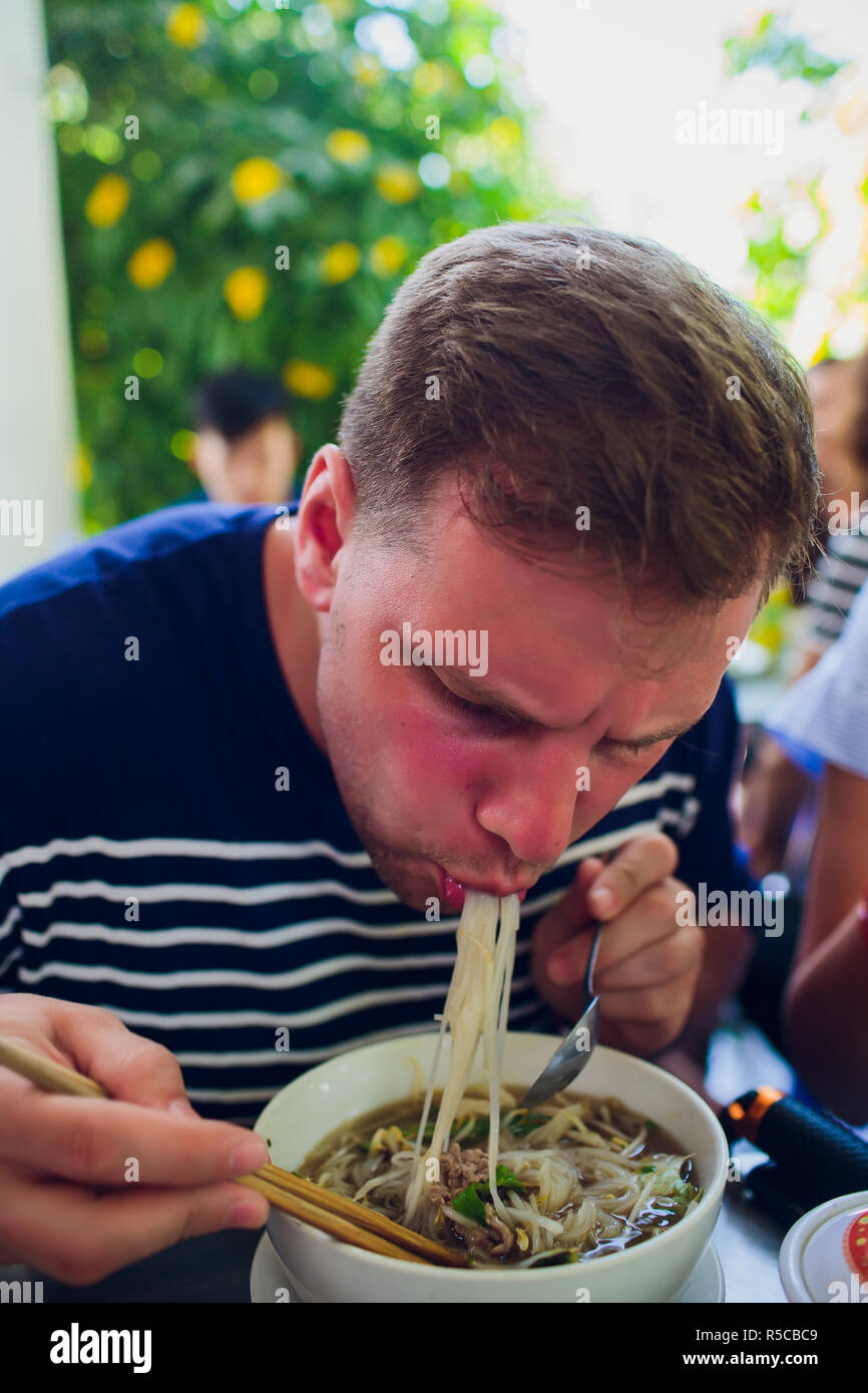 man eating soup fo in vietnam asia Stock Photo Alamy