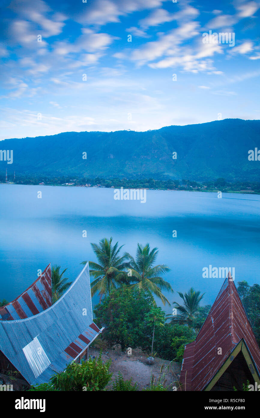 Indonesia, Sumatra, Samosir Island, Tuk Tuk, Typical Batak houses overlooking Lake Toba Stock Photo