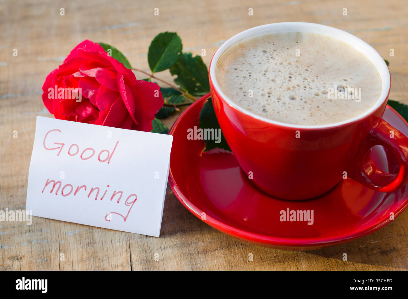 Coffee cup with red rose flower and notes good morning on wooden rustic  table from above, breakfast on Mothers day, Womens day or Valentines day  Stock Photo - Alamy