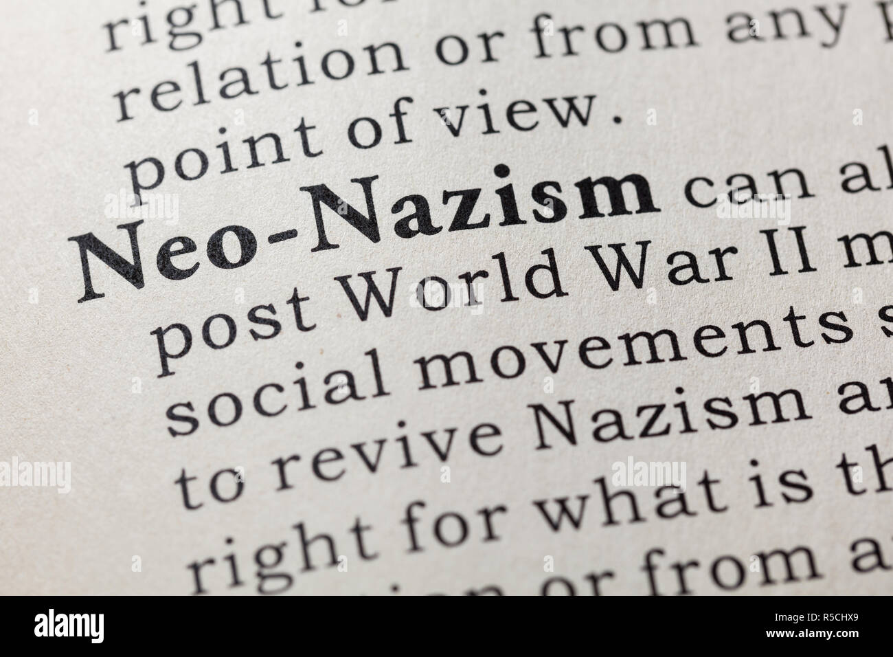 Fake Dictionary, Dictionary definition of the word Neo-Nazism. including key descriptive words. Stock Photo