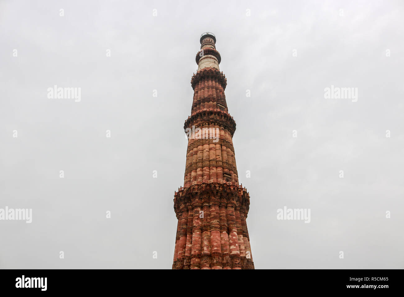 Qutub Minar, 73-meter tall tapering tower of five storeys, started construction by Qutab-Ud-Din-Aibak, founder of the Delhi Sultanate Stock Photo