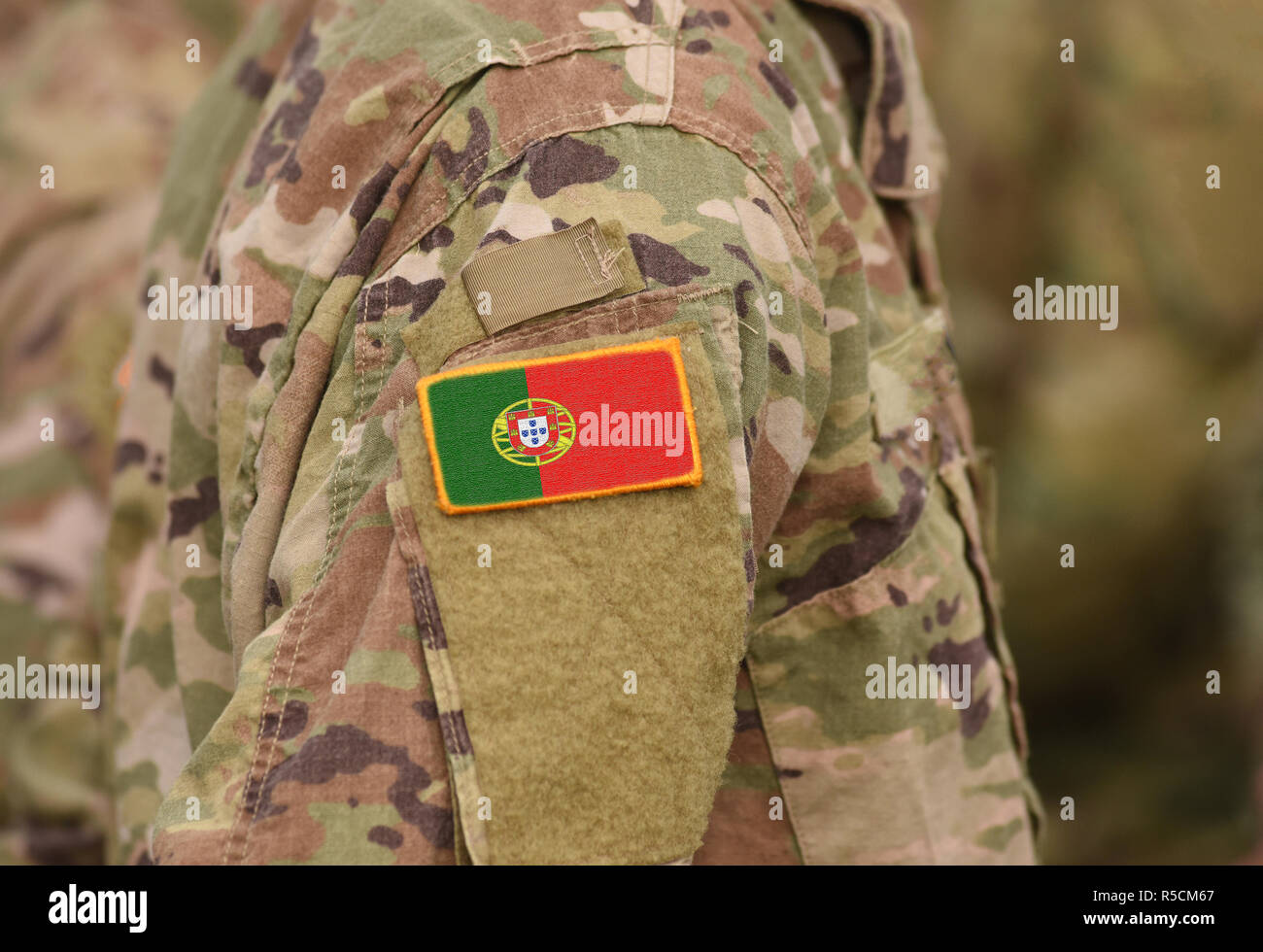 Flag of Portugal on soldiers arm (collage). Stock Photo