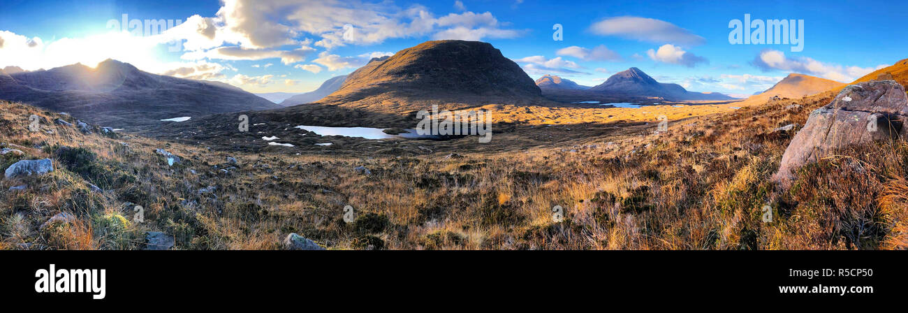 BEINN EIGHE NATIONAL NATURE RESERVE, Scotland. View from within the Torridonian Mountains. The peaks rising from the moor are left to right from centre Baosbheinn, known as the Wizard's Mountain, Beinn am Eoin and Beinn a'Chearchaill. Photo: Carolyn Robertson Stock Photo