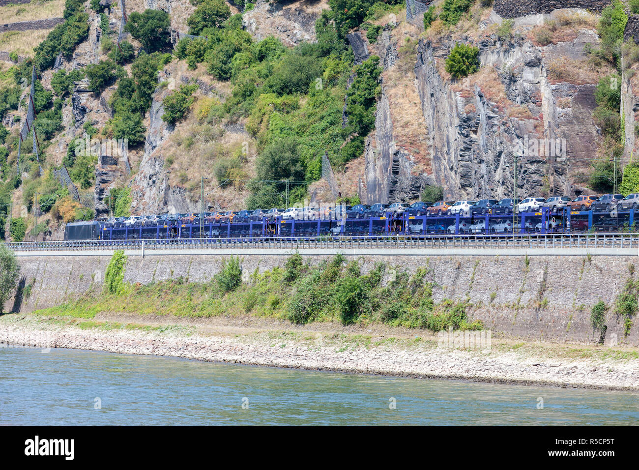 Rhine River Valley, Germany.  Train Carrying New Cars to Market. Stock Photo