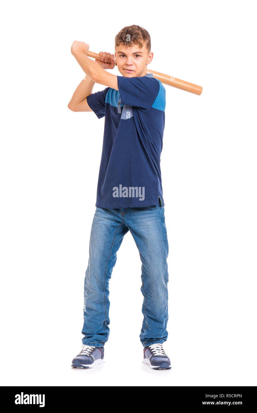 Full length portrait of young caucasian teen boy holding a baseball bat. Funny teenager hooligan looking at camera, isolated on white background. Hand Stock Photo