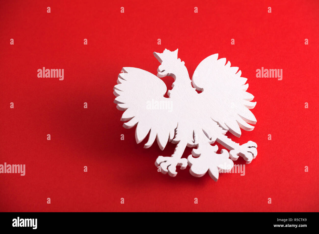 Polish coat of arms on red background Stock Photo