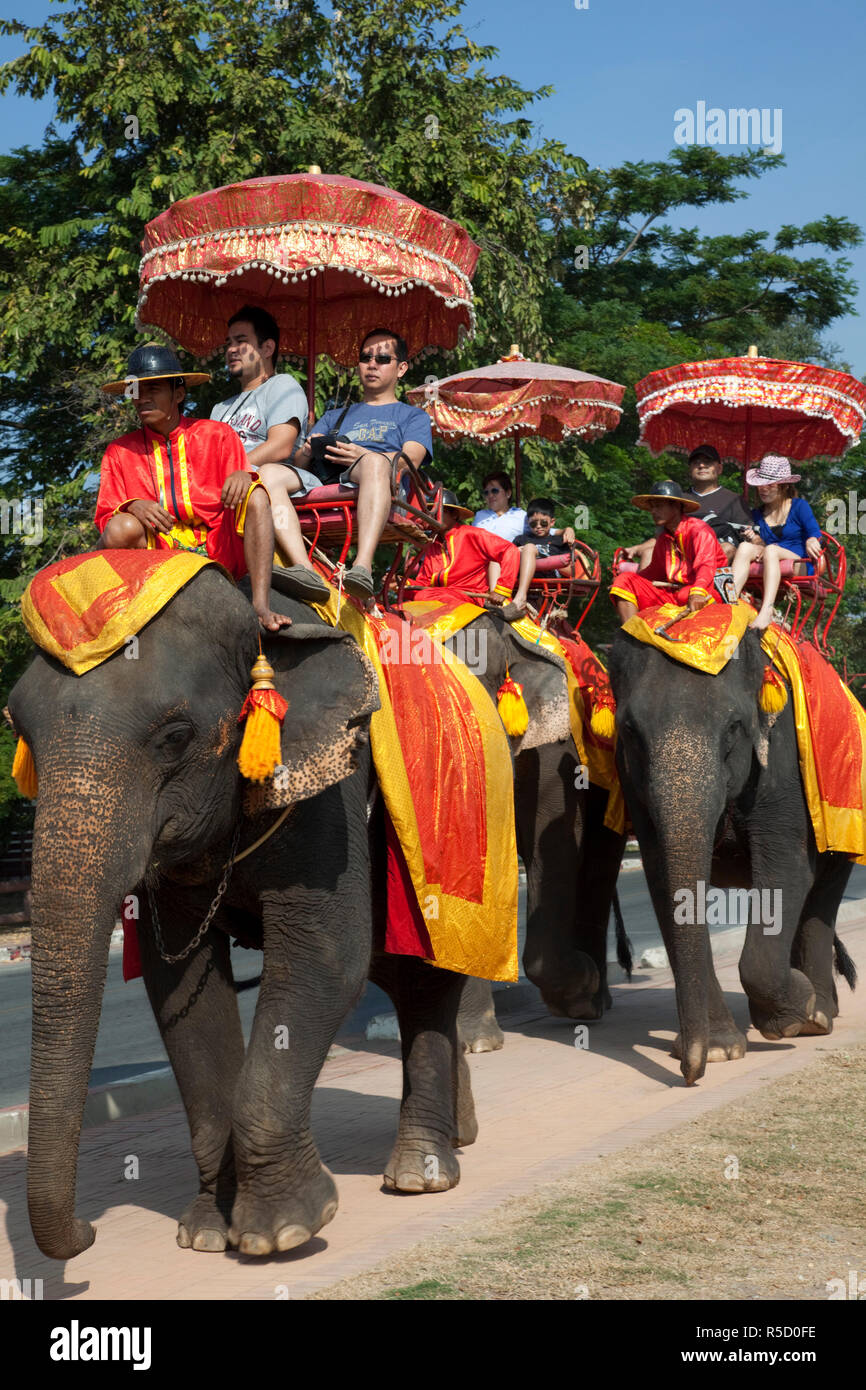 Thailand, Ayutthaya, Ayutthaya Historical Park, Tourists Riding Elephants Stock Photo