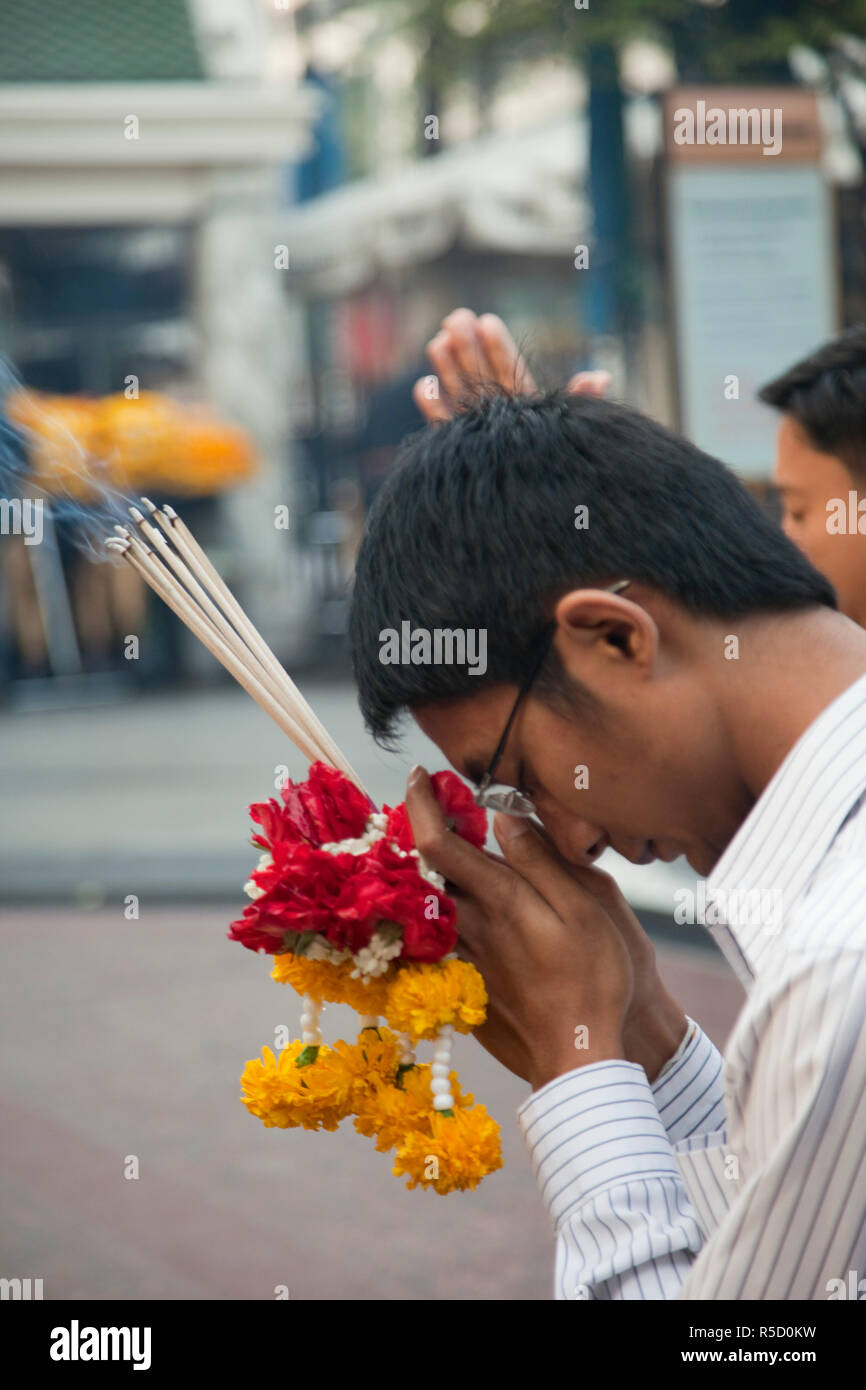 Thailand, Bangkok, Man Preying at Erawan Shrine Stock Photo