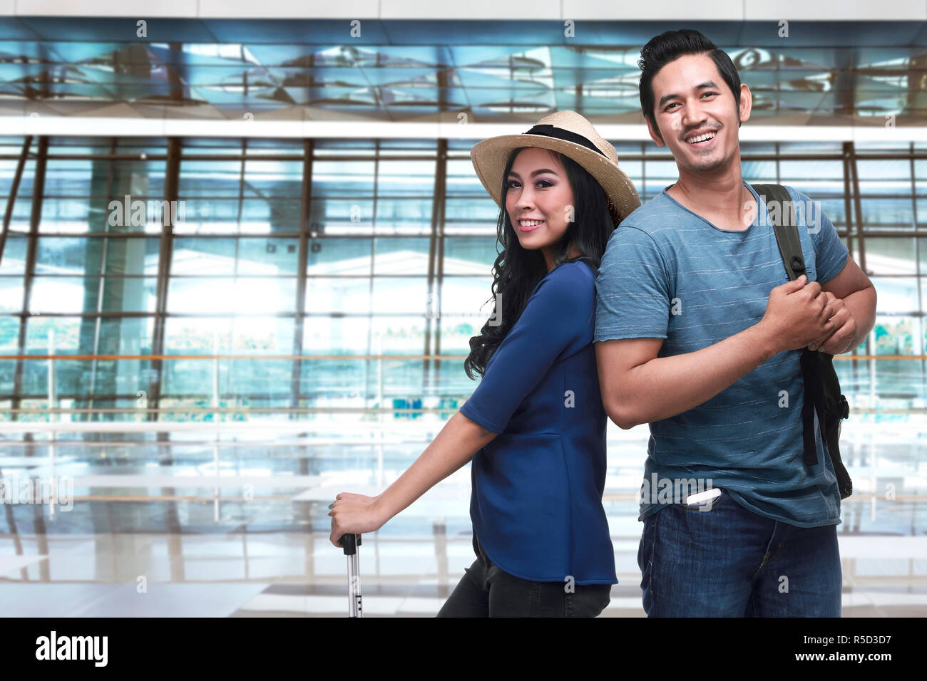 Young asian tourist couple going traveling Stock Photo