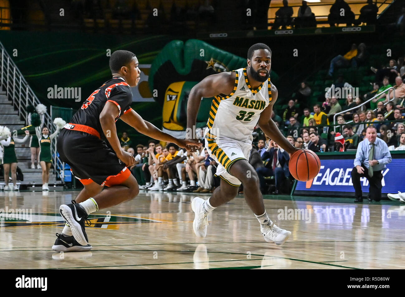 Fairfax, Virginia, USA. 28th Nov, 2018. IAN BOYD (32) charges down the court against SHERWYN DEVONISH (5) during the game held at Eaglebank Arena in Fairfax, Virginia. Credit: Amy Sanderson/ZUMA Wire/Alamy Live News Stock Photo