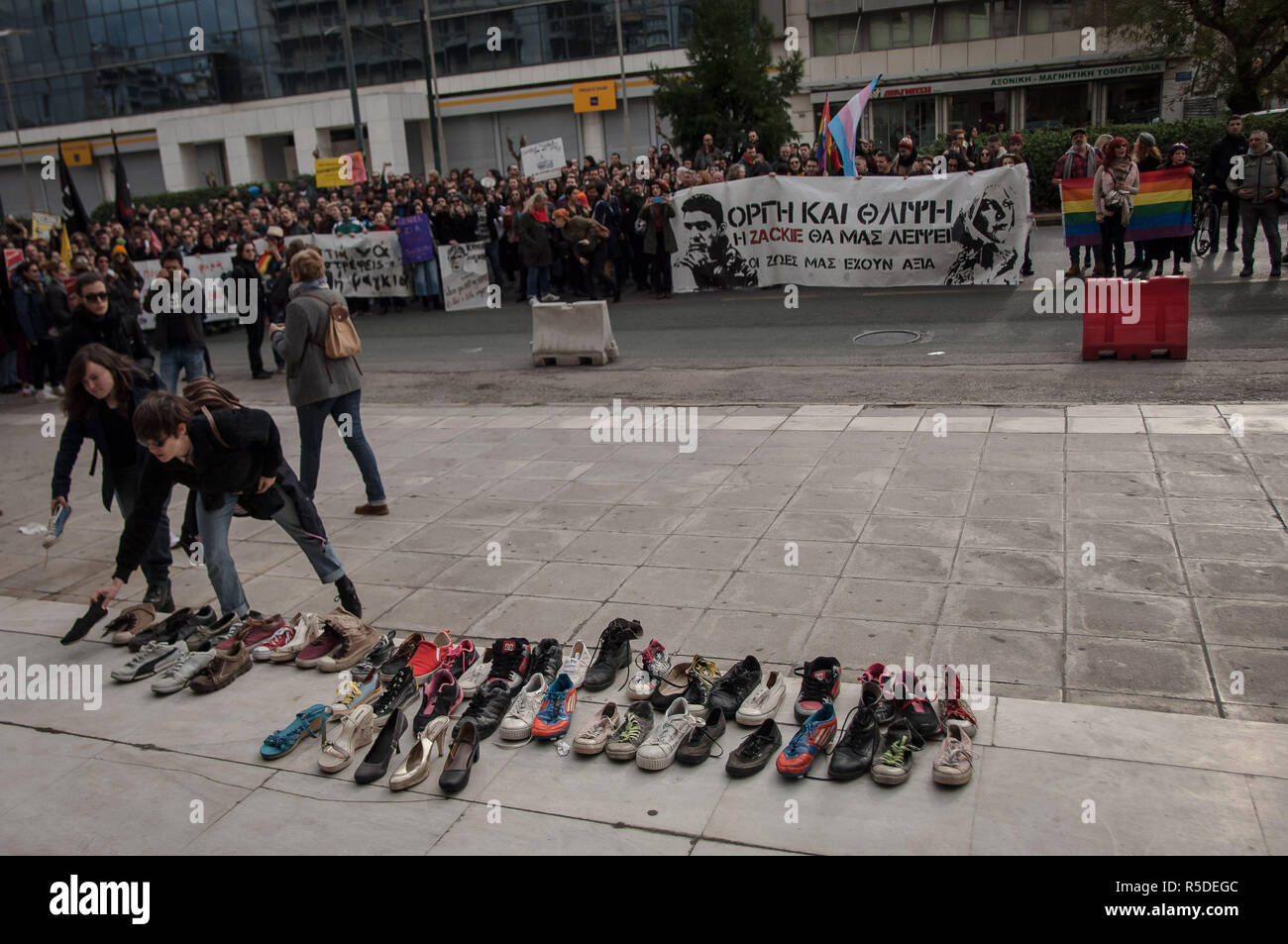 Athens, Greece. 1st Jan, 2006. Protesters are seen leaving their shoes in  front of the General Police Directorate of Attica offices during the  protest.Activists protest in the Memory of Zak Kostopoulos a