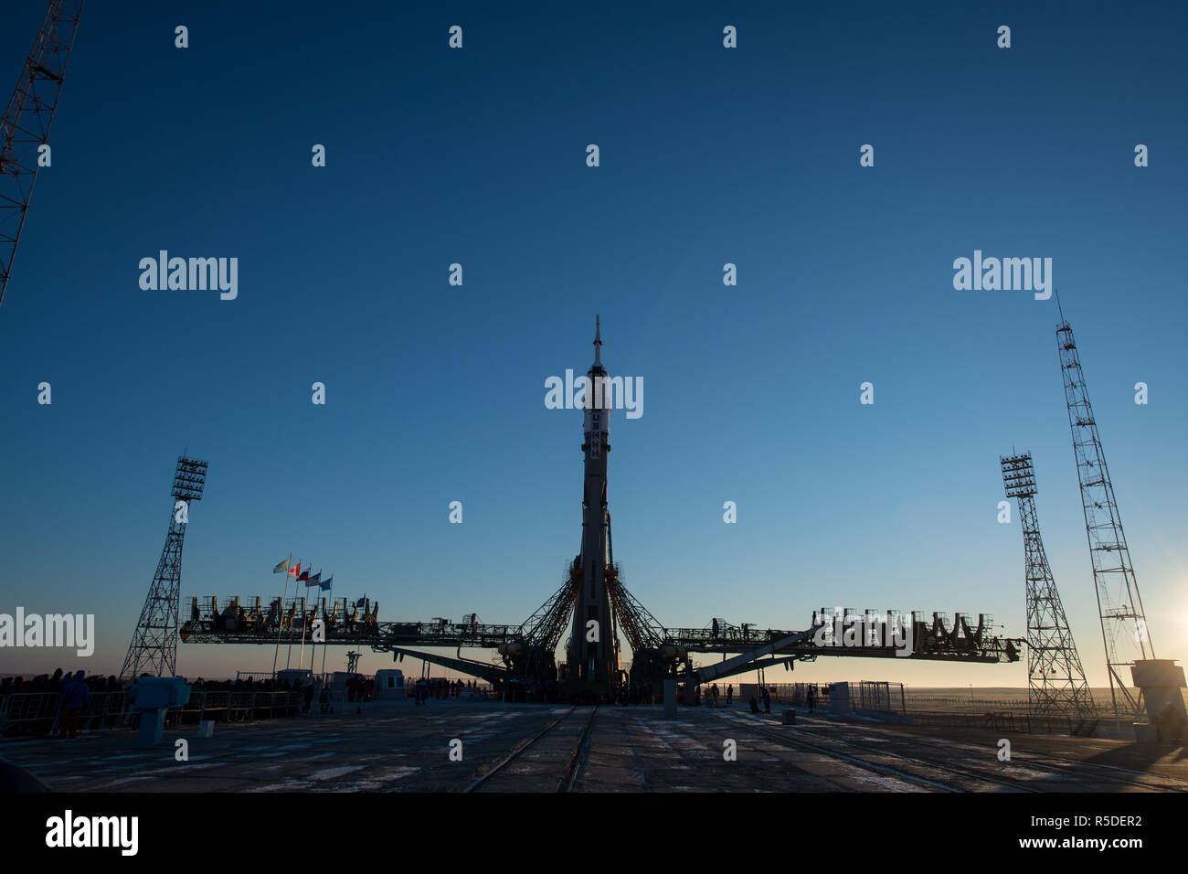 Baikonur, Kazakhstan, 1st December 2018. The Soyuz booster rocket and MS-11 spacecraft is upright on the launch pad as the gantry arms begin to close early morning at the Baikonur Cosmodrome December 1, 2018 in Baikonur, Kazakhstan. The rocket will carry Expedition 58 crew members Russian Oleg Kononenko of Roscosmos, American Anne McClain and Canadian David Saint-Jacques to the International Space Station on December 3rd. Credit: Planetpix/Alamy Live News Stock Photo