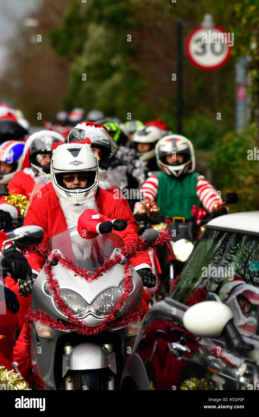Bristol, UK. 1st December 2018. Hundreds of Santa's on a bike rode through the City of Bristol in aid of Childrens Hospice South West,images show riders at the top of Whiteladies Road on a dry and cold afternoon.Robert Timoney/Alamy/Live/News Stock Photo