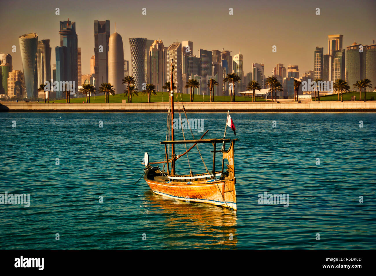 Modern Doha Skyline with Traditional Dhow Boat Stock Photo