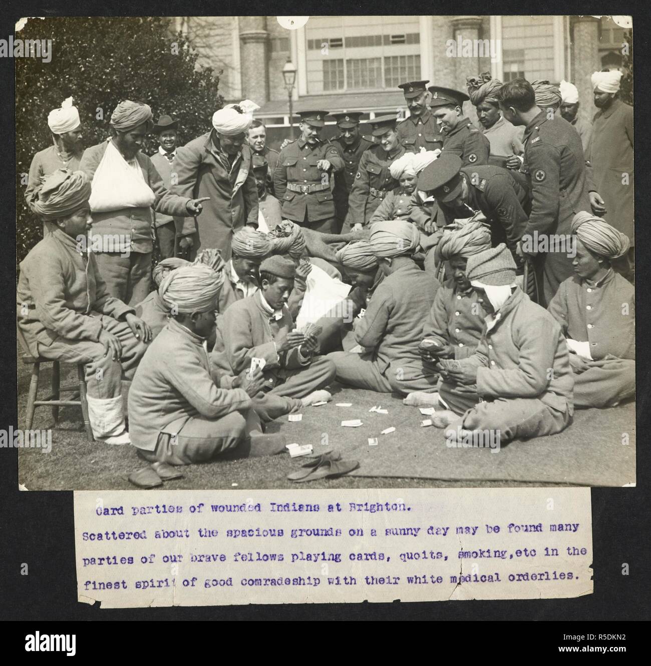 Card parties of wounded Indians at Brighton. Indian soldiers playing cards, watched by medical orderlies. Record of the Indian Army in Europe during the First World War. 20th century, 1915. Gelatin silver prints. Source: Photo 24/(20). Language: English. Author: Girdwood, H. D. Stock Photo