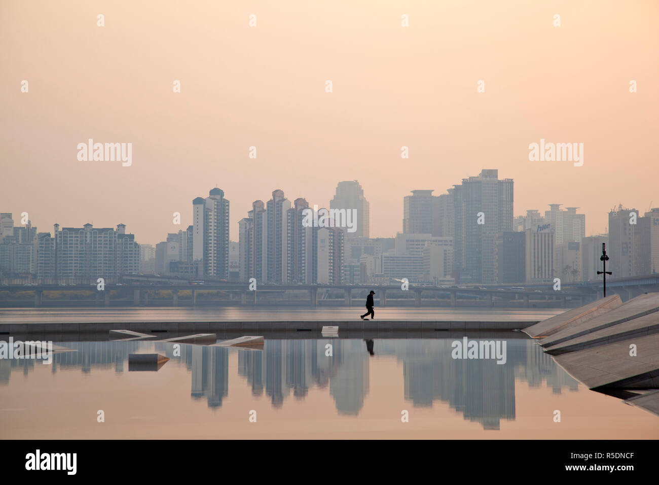 Korea, Seoul, Yeouido, View of city from Hangang Riverside Park at dawn Stock Photo