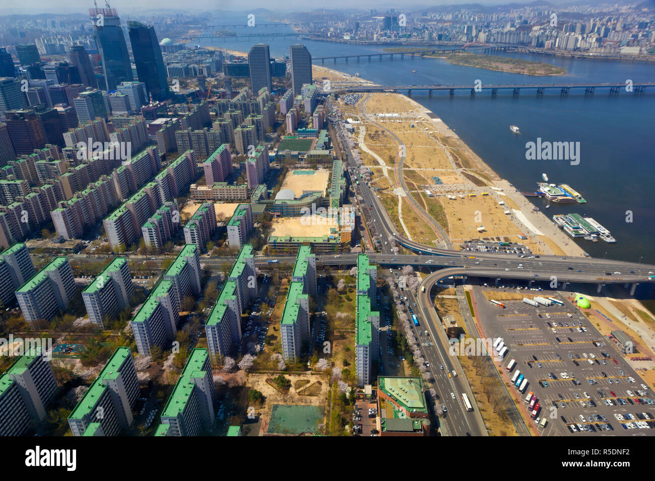 Korea, Seoul, Yeouido, View of Yeouido appartment buildings and Hangang river and Hangang riverside park from 63 Building Stock Photo