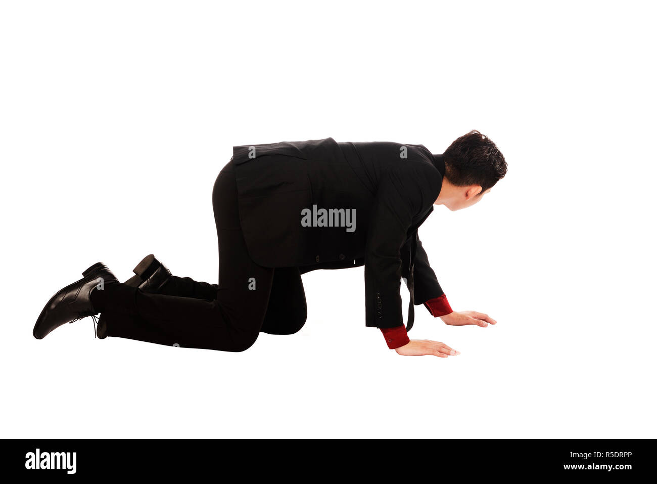 Asian Business Man Crouching Stock Photo