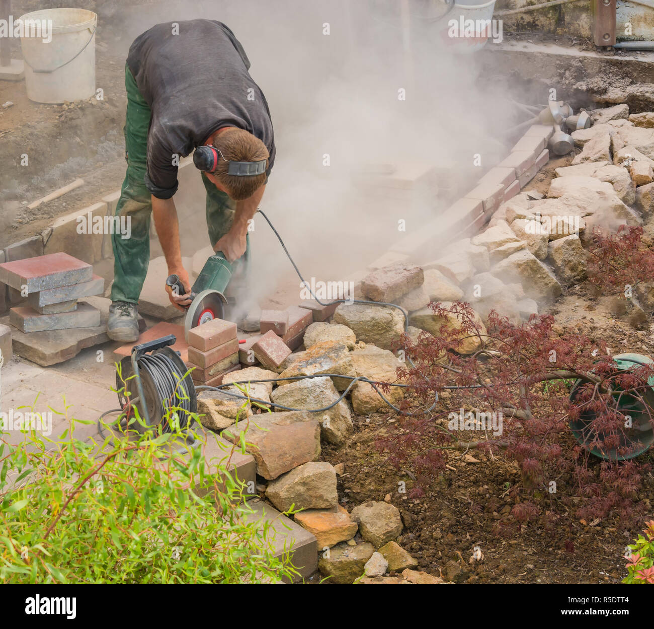 craftsman works with an electric grinder Stock Photo Alamy