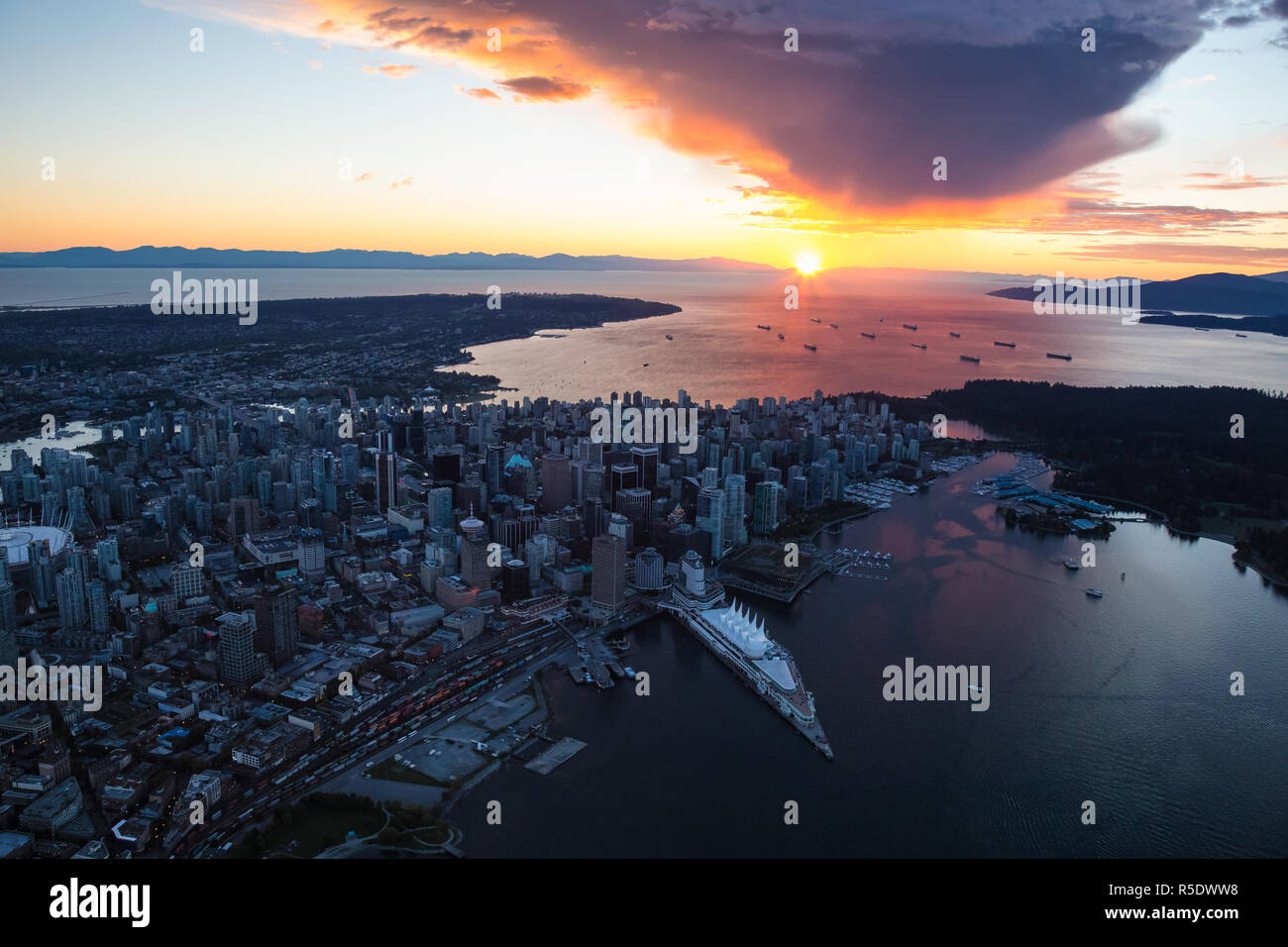 Aerial view of Downtown Vancouver, BC, Canada, during a vibrant sunset ...
