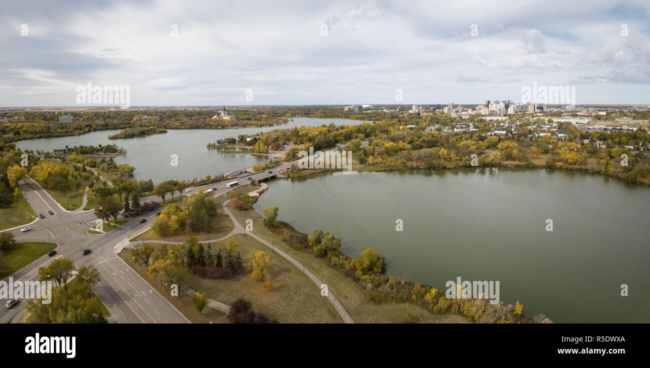 Aerial panoramic view of Wascana Lake during a vibrant day in the Fall Season. Taken in Regina, Saskatchewan, Canada. Stock Photo